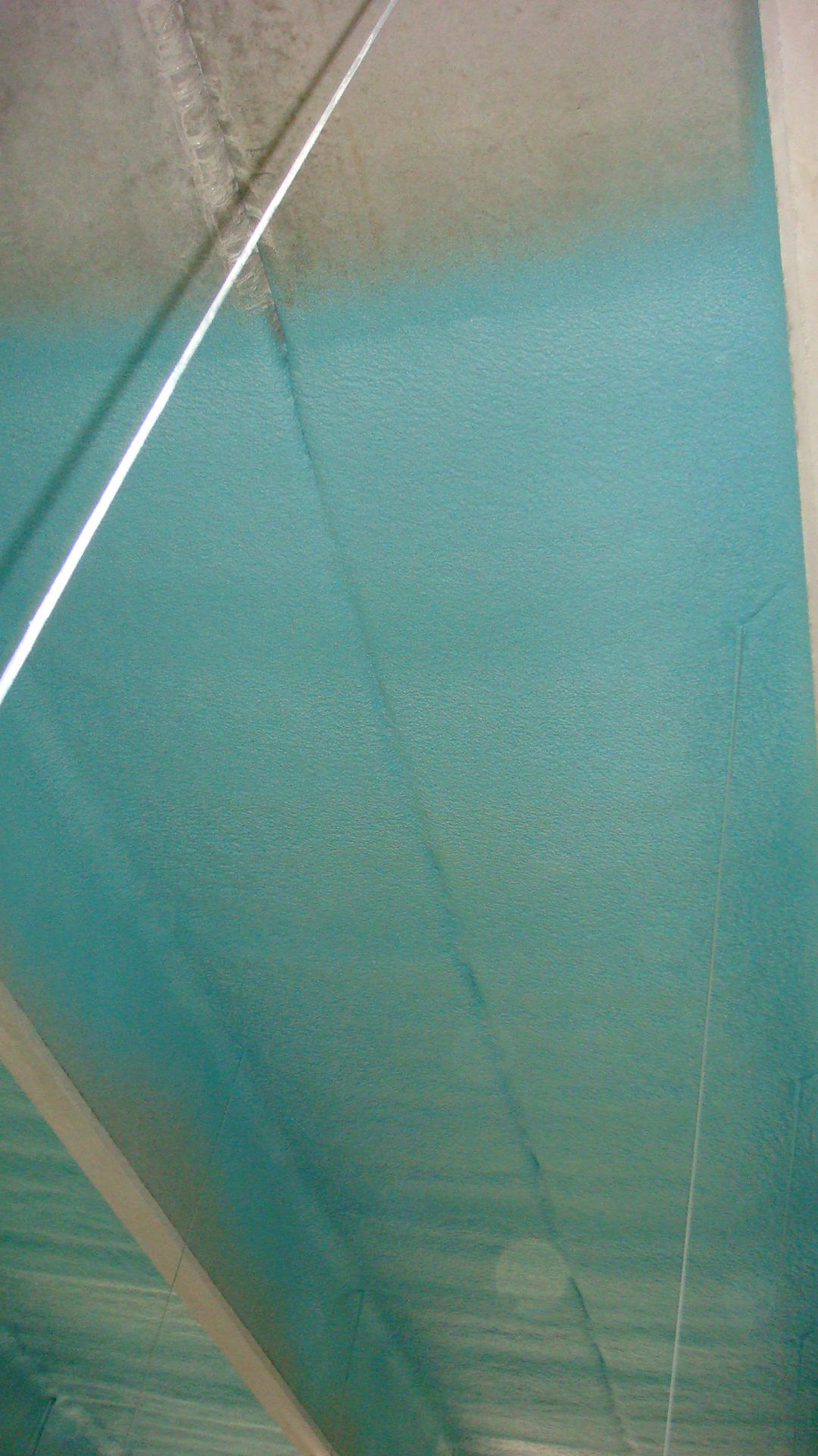 Polyurea protective coating applied to industrial steel