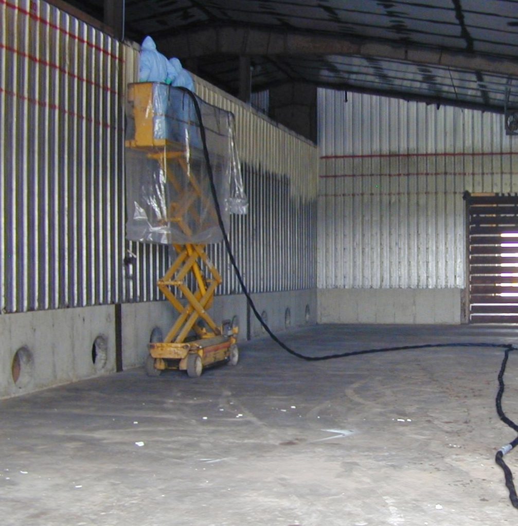 Spray foam insulation applied inside an agricultural storage building