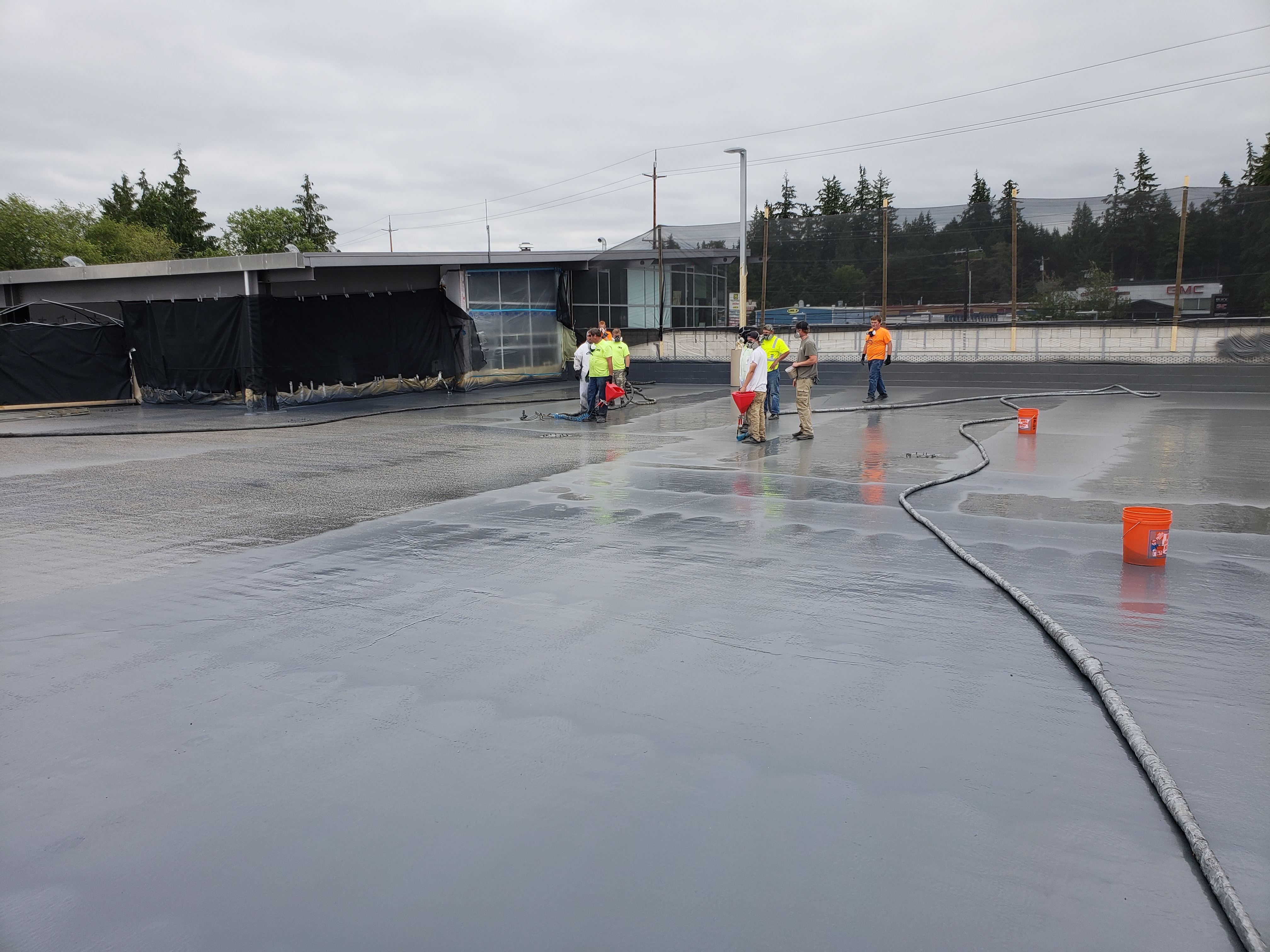 Commercial roof restoration with sprayed polyurea membrane